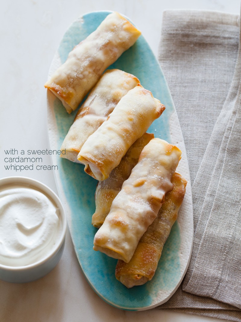 baked apple pie egg rolls with a sweetened cardamom whipped
