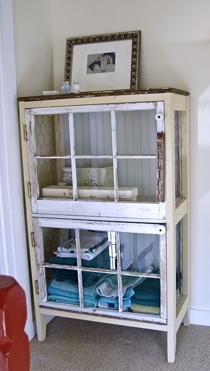 cabinet constructed of two salvaged windows (the