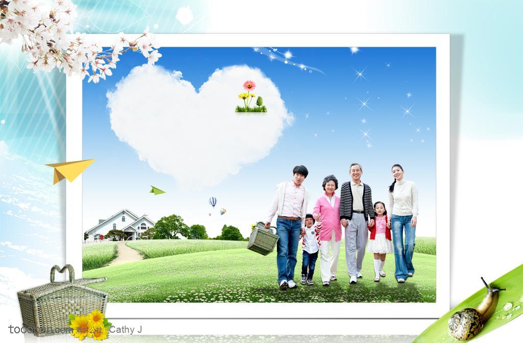 提着竹篮站在草地上的大家庭和别墅建筑背景