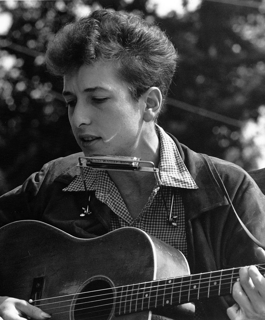 closeup view of vocalists joan baez and bob dylan