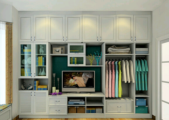 满墙的整体衣柜,抽屉和掩门柜的不规则搭配使衣柜充满视觉动感.