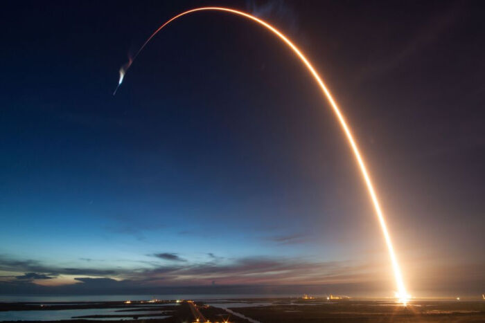 spacex falcon 9 rocket launched and its brilliant light over